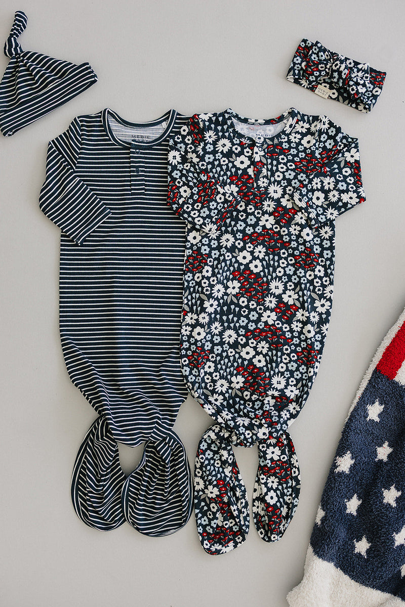 A red, white, and blue floral print highlights the Mebie Baby Americana Floral Bamboo Knot Gown, perfect for cozy newborn baby clothes