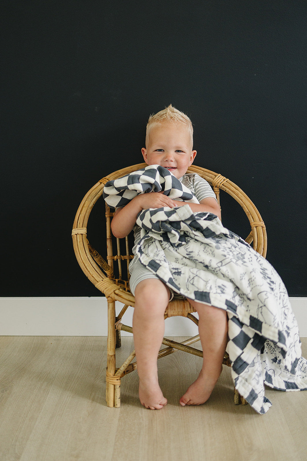 Mebie BabyÕs Charcoal Checkered + Summit Muslin Quilt offers breathable comfort as a gentle muslin.