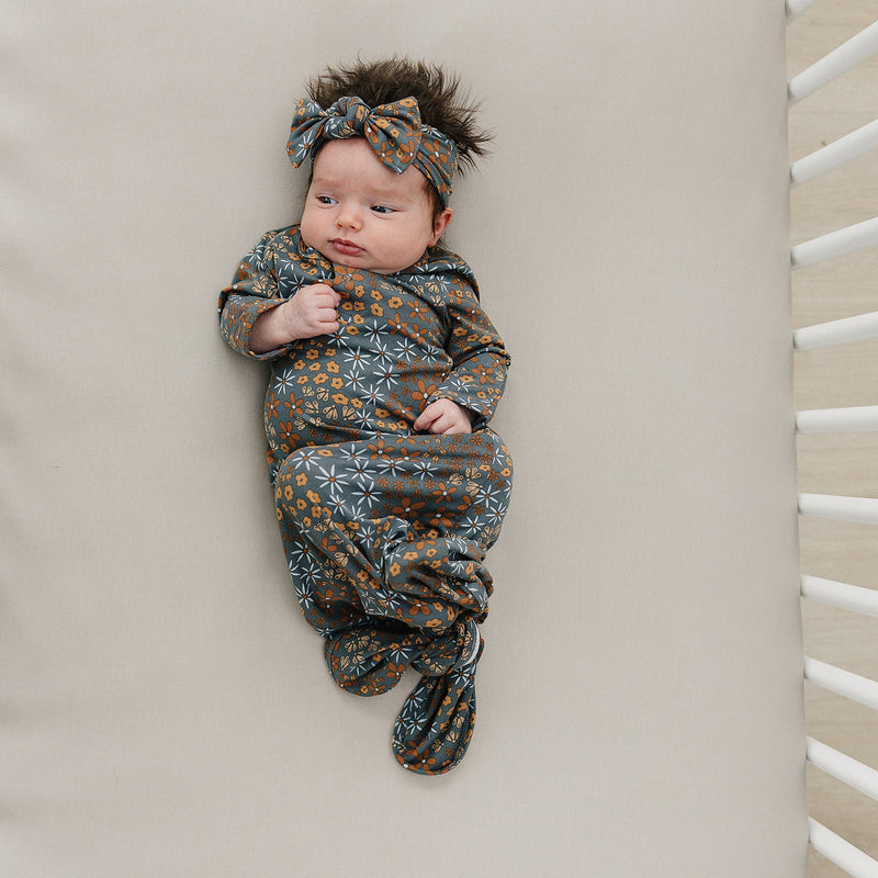 Designed with breathable bamboo, the Mebie Baby Navy Floral Bamboo Knot Gown works beautifully as bamboo baby pajamas