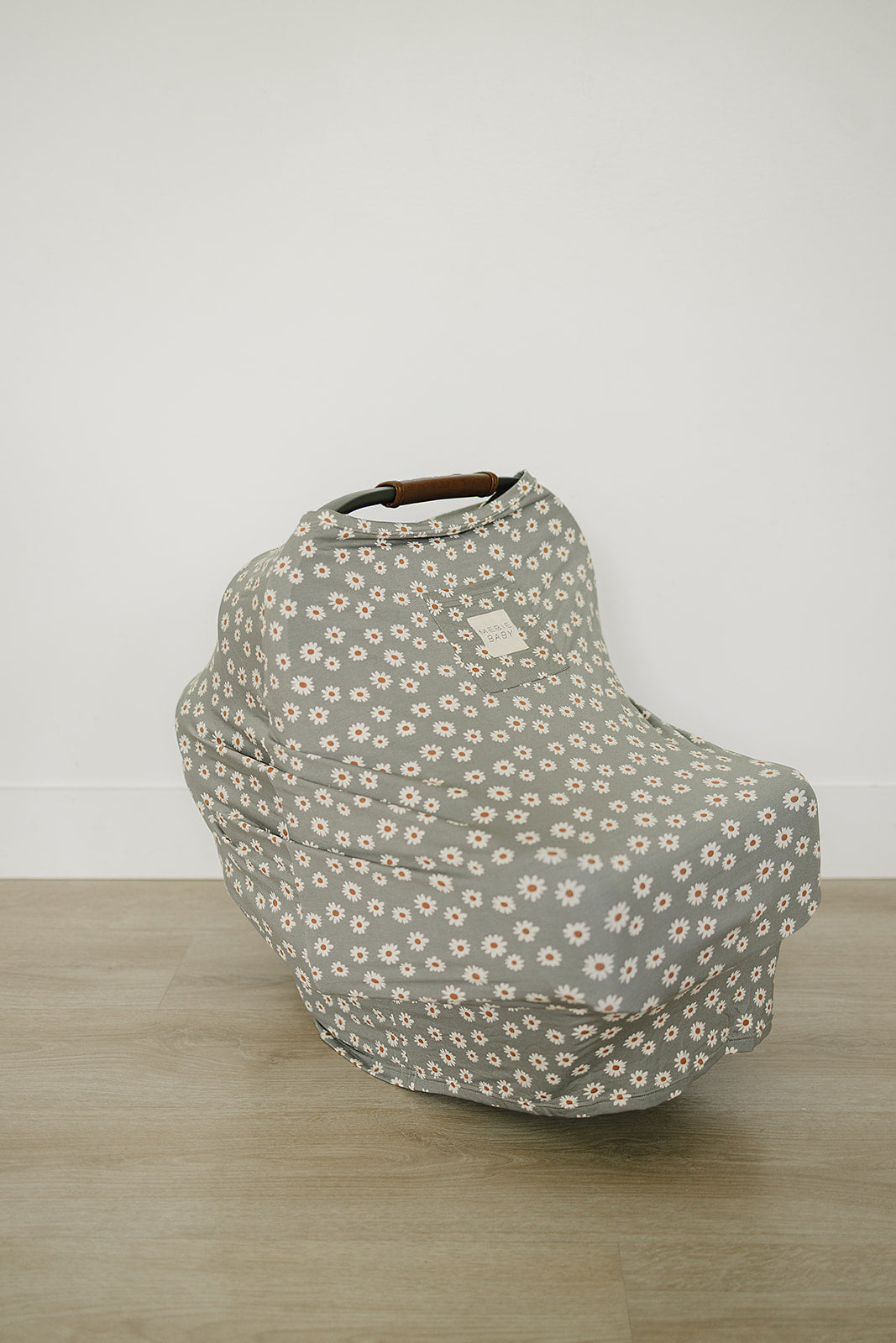 Gentle stretch and floral charm make this Mebie Baby Light Green Daisy Bamboo Multi-Use Cover an effortless swaddle choice.