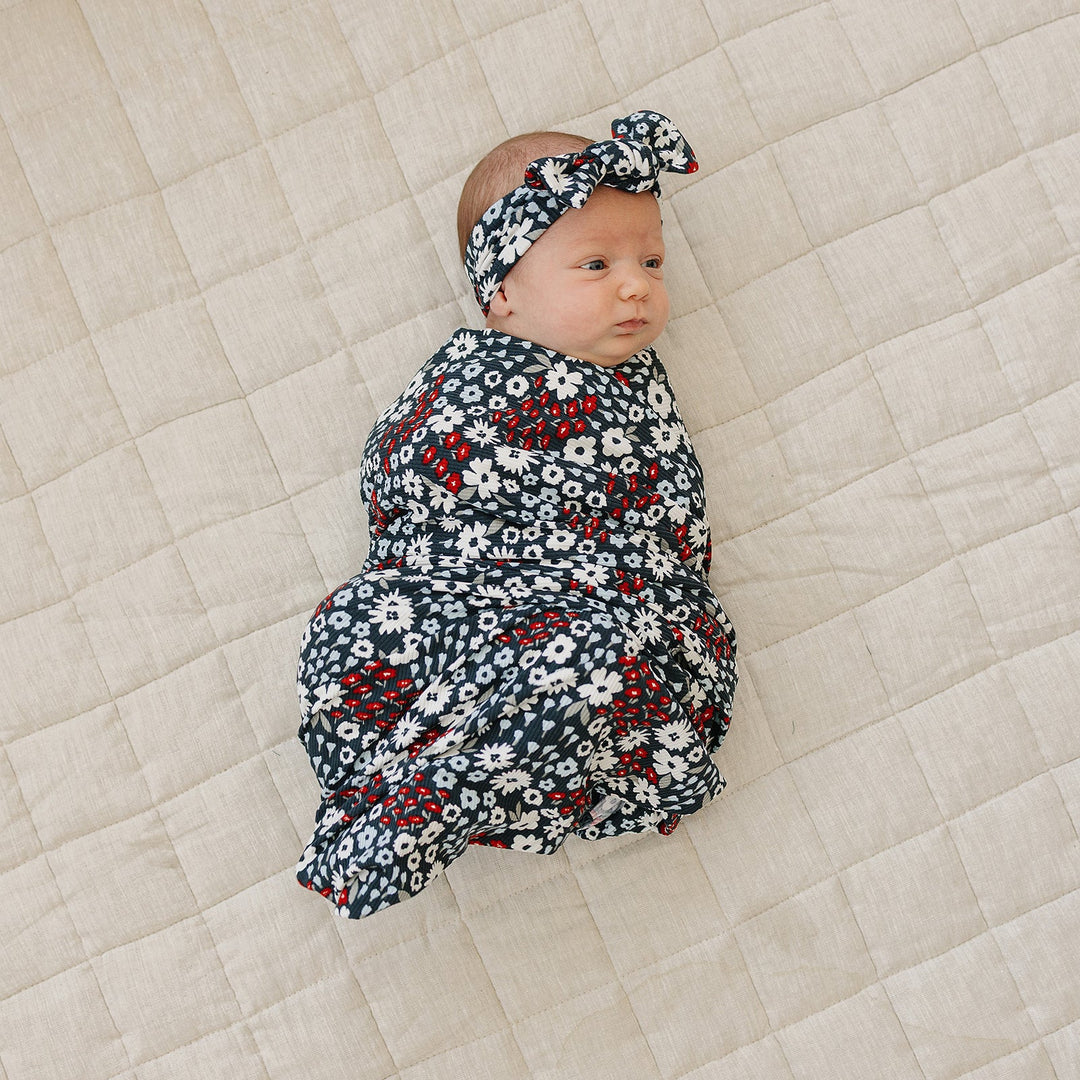 Cuddle your infant with the Mebie Baby Americana Floral Ribbed Bamboo Stretch Swaddle, a gentle baby swaddle wrap.