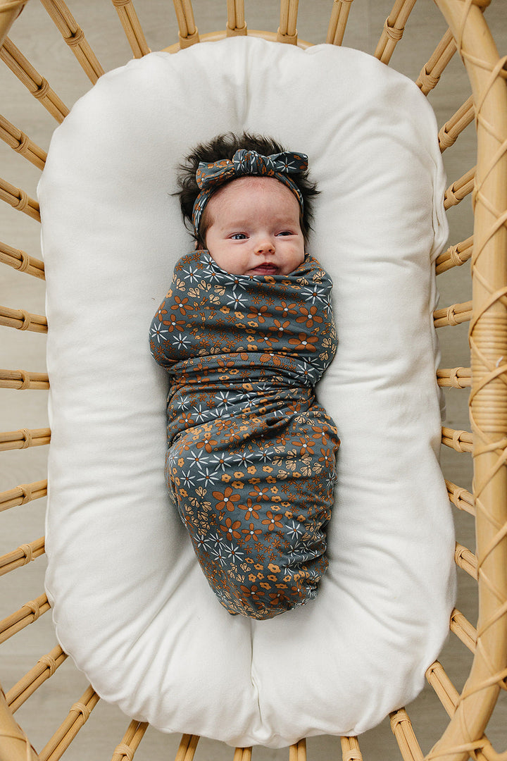 Keep your little one cozy with the Mebie Baby Navy Floral Bamboo Stretch Swaddle, ideal baby swaddle blankets.