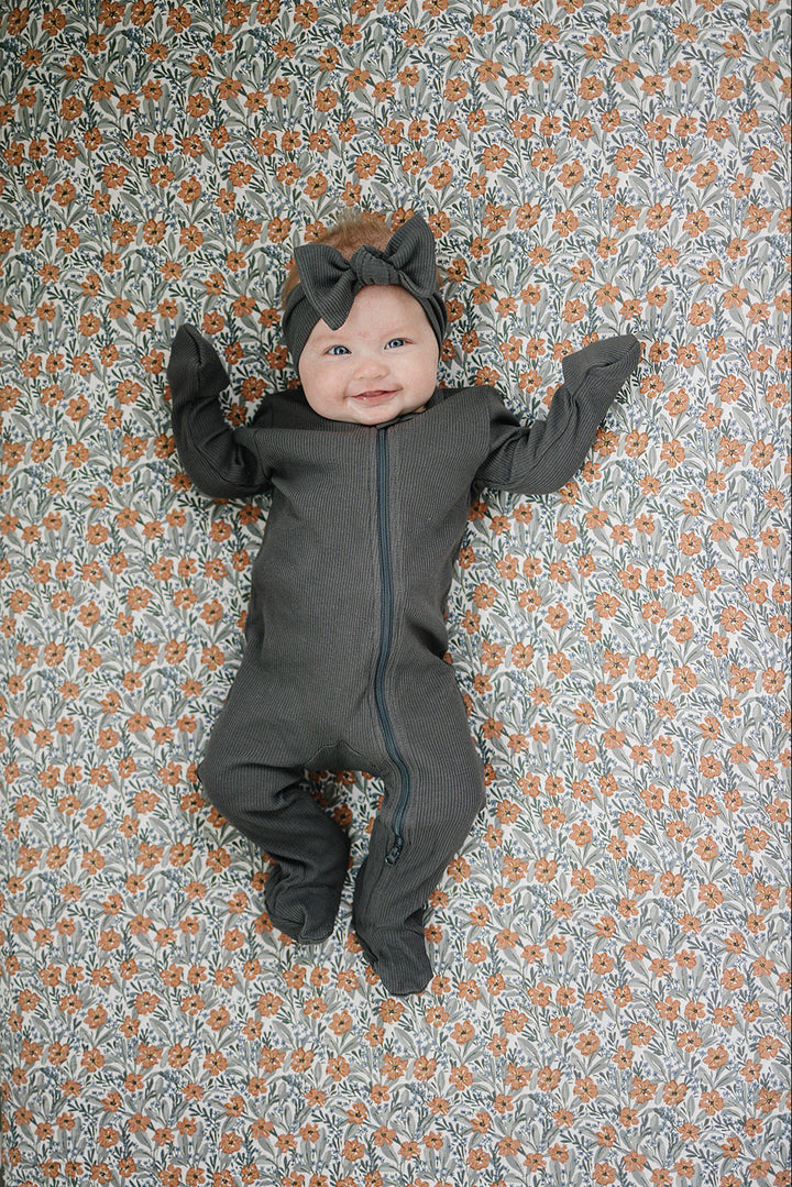 Soft and breathable, the Mebie Baby Dainty Meadow Bamboo Stretch Crib Sheet ranks among the best crib sheets.