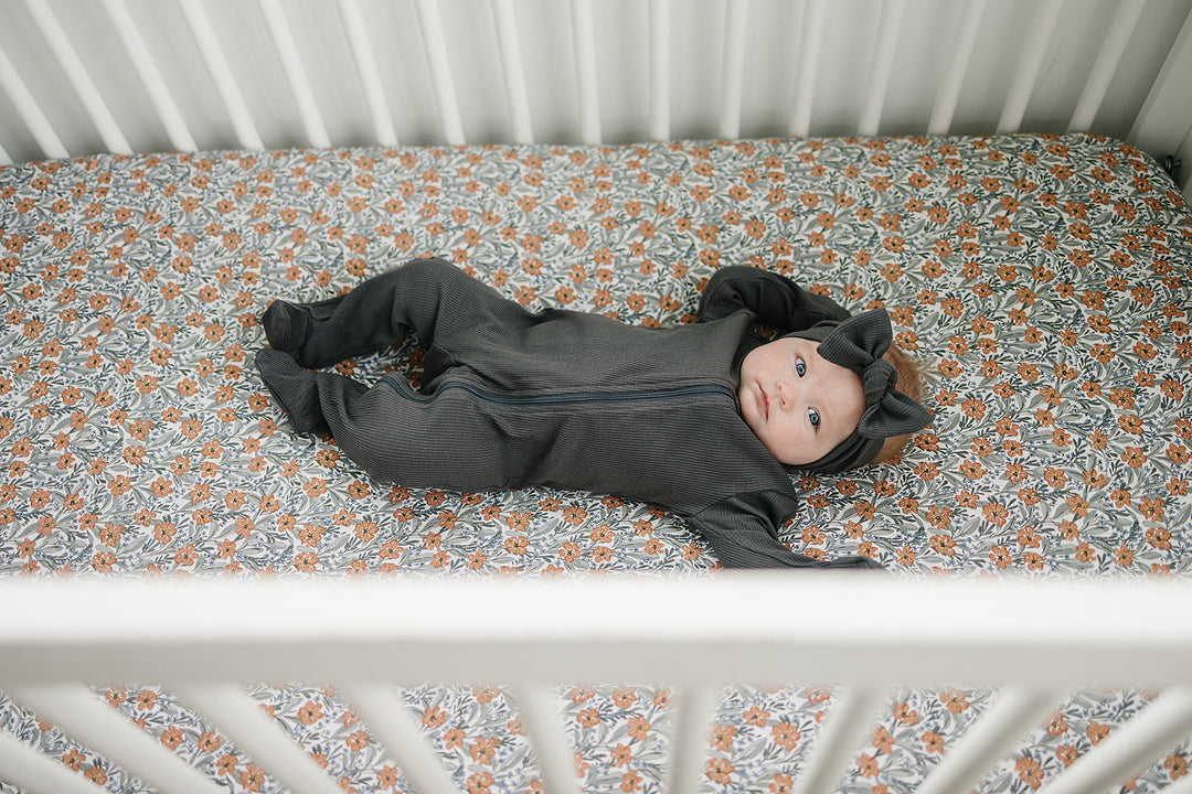 The Mebie Baby Dainty Meadow Bamboo Stretch Crib Sheet offers a snug fit, perfect fitted crib sheets for infants.