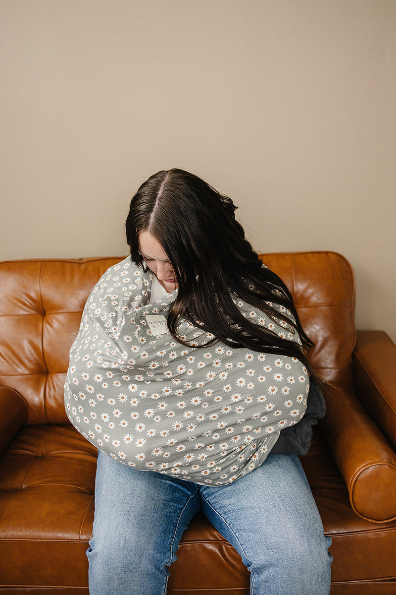 Designed to adapt, Mebie Baby Light Green Daisy Bamboo Multi-Use Cover transitions easily into everyday swaddles.