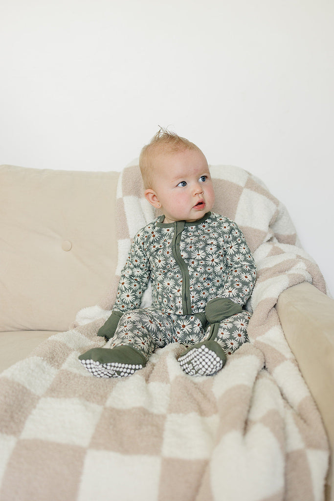 Baby wearing the organic bamboo zip up pajamas by Mebie Baby