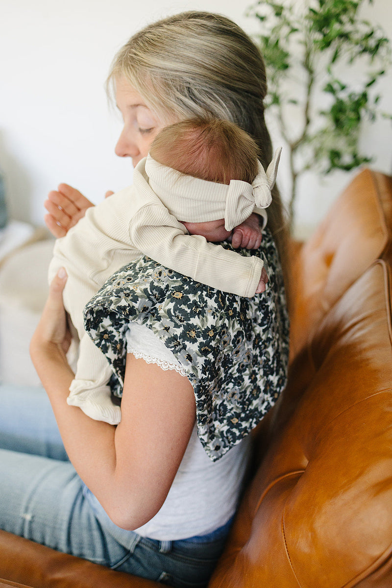 Ideal as organic burp cloths, the Liberty Floral Muslin Burp Cloth by Mebie Baby combines style and function.