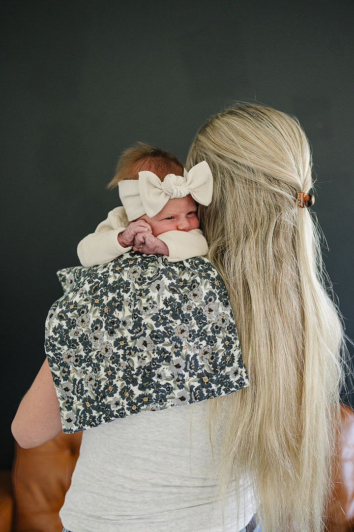 Keep messes under control during feedings with the Liberty Floral Muslin Burp Cloth by Mebie Baby.