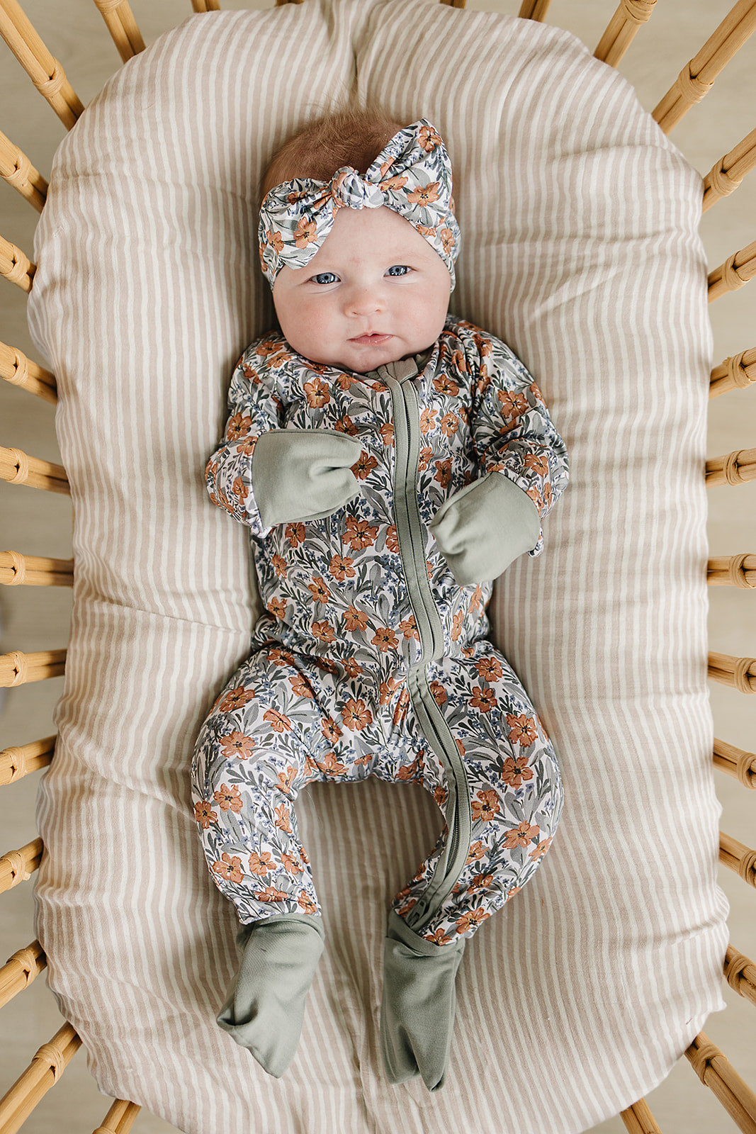Featuring delicate meadow florals, the Mebie Baby Dainty Meadow Bamboo Zipper works beautifully as comfy onesie pajamas