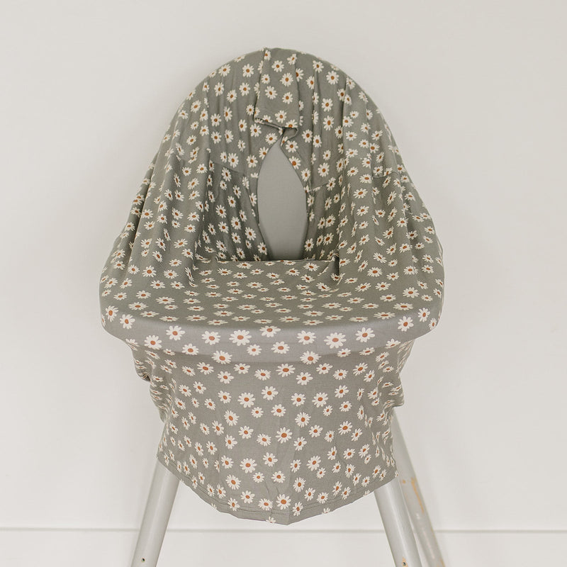 For cozy moments on the go, the Light Green Daisy Bamboo Multi-Use Cover from Mebie Baby works beautifully as a baby swaddle.