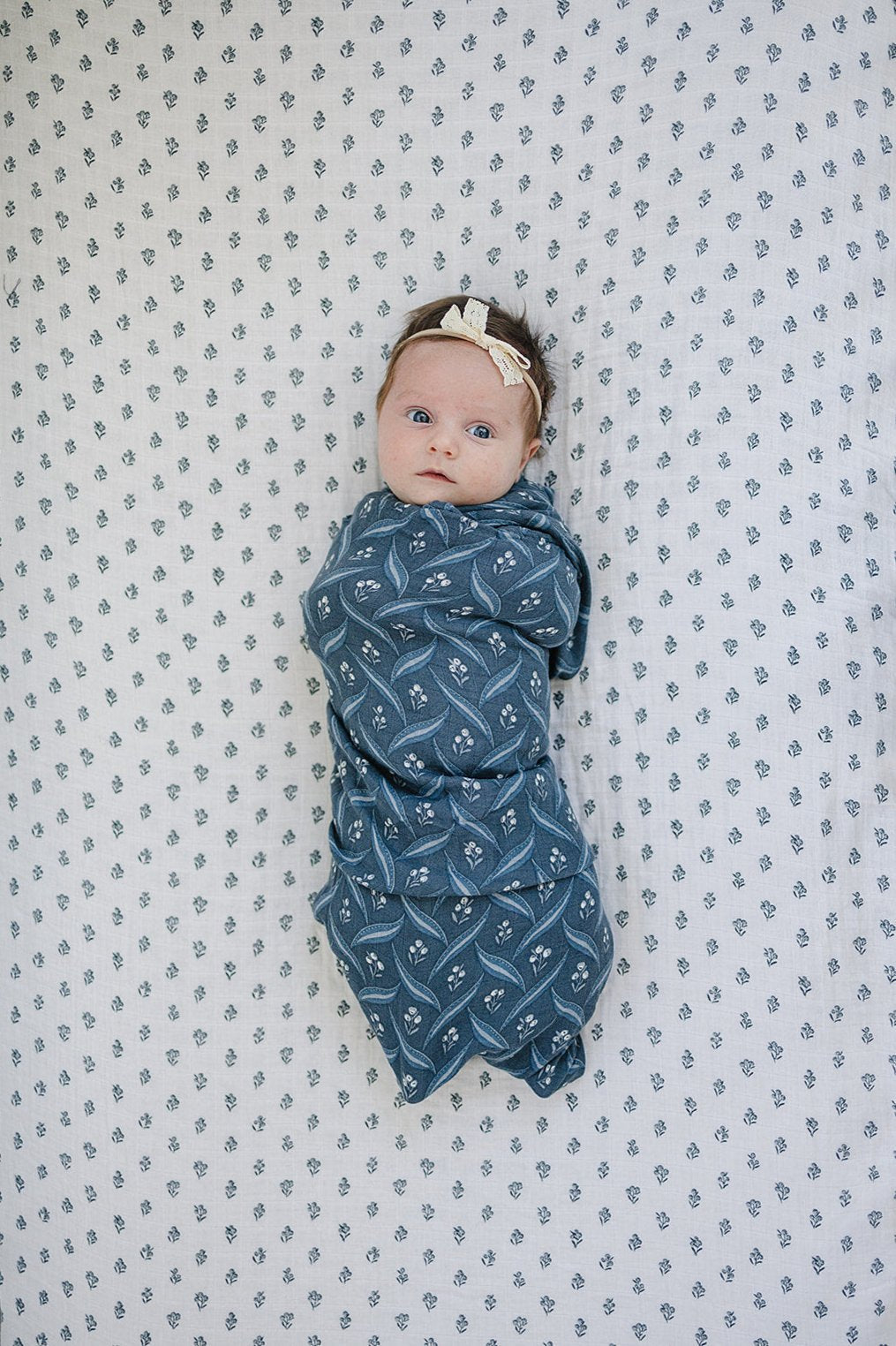 Wrap your newborn in the Mebie Baby Navy Berry Muslin Swaddle Blanket, perfect as muslin swaddle blankets.