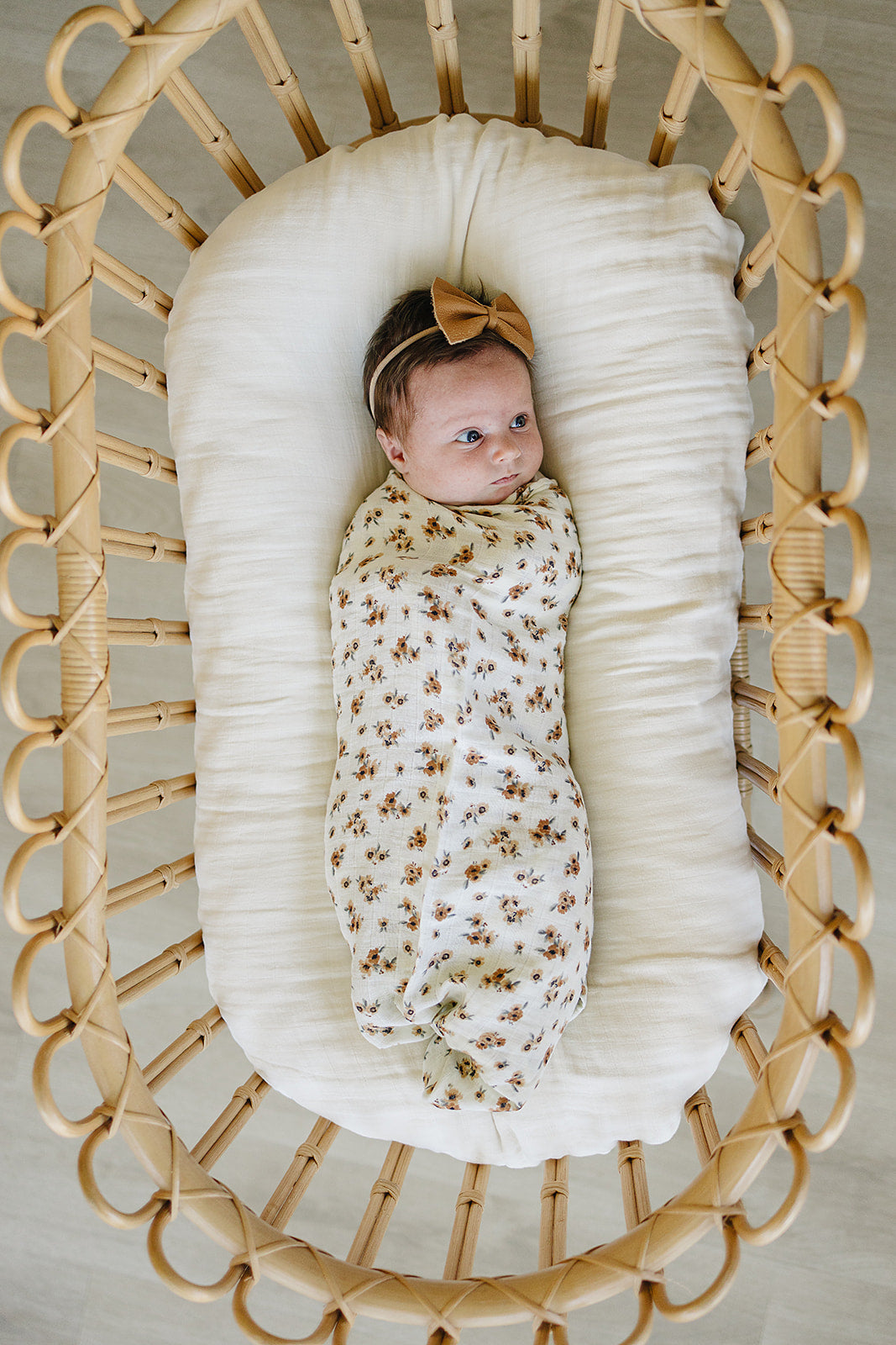 Nursery favorite, the Mebie Baby Autumn Bloom Muslin Swaddle Blanket doubles as a cozy muslin swaddle.