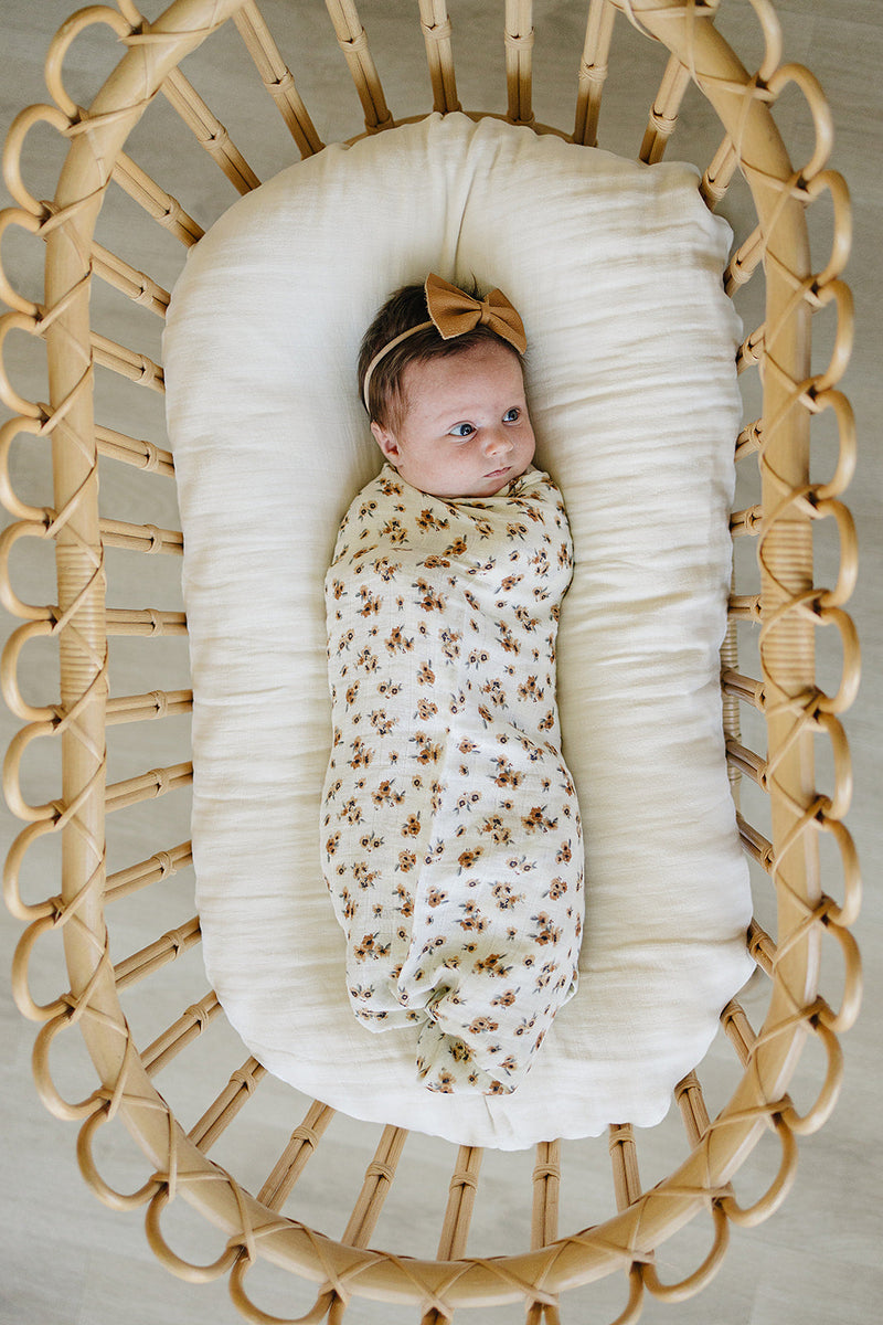 Nursery favorite, the Mebie Baby Autumn Bloom Muslin Swaddle Blanket doubles as a cozy muslin swaddle.