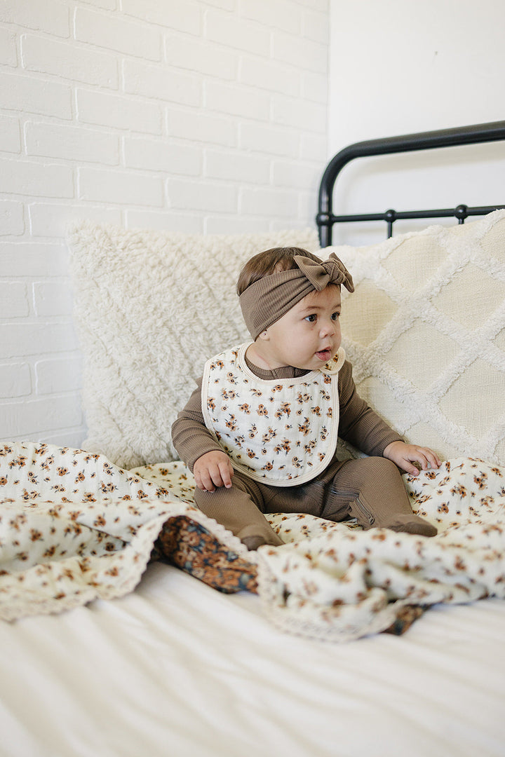 Gentle on sensitive skin, the Mebie Baby Venetian Floral + Autumn Bloom Lace Muslin Quilt works as infant muslin blankets.