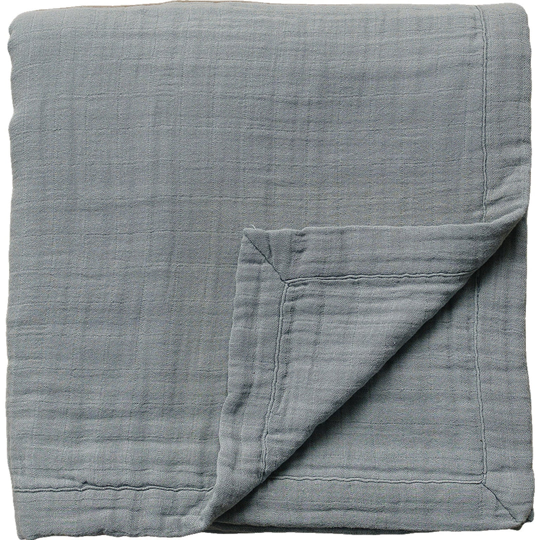 Soft and breathable, the Dusty Blue Muslin Quilt by Mebie Baby is a cozy muslin baby blanket for little ones.