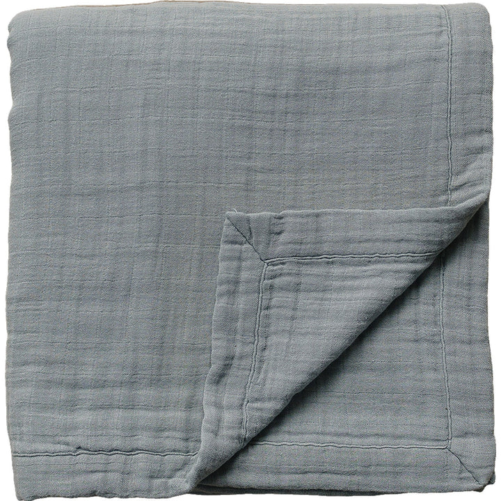Soft and breathable, the Dusty Blue Muslin Quilt by Mebie Baby is a cozy muslin baby blanket for little ones.