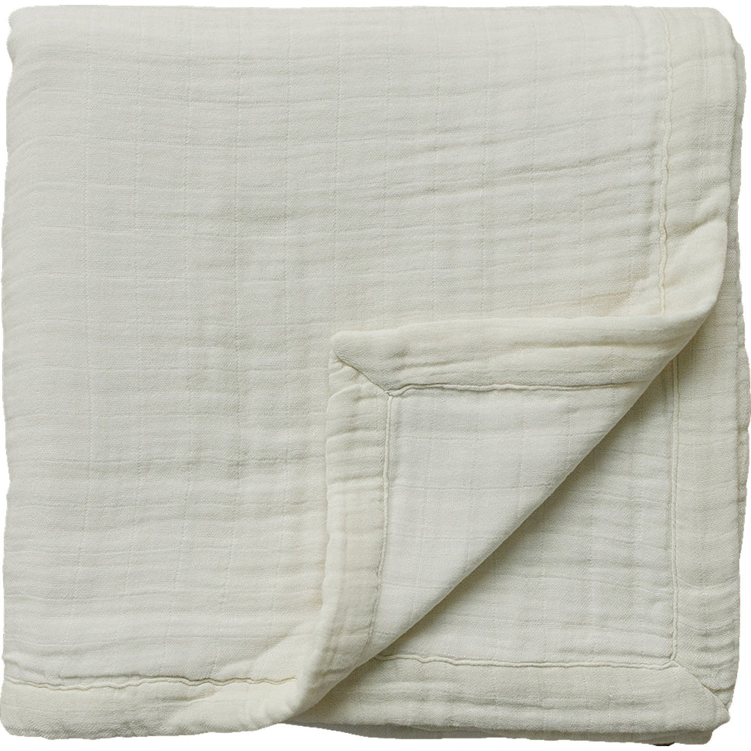 Snuggle your baby in the Mebie Baby Cream Muslin Quilt, a soft baby blanket for cozy naps.