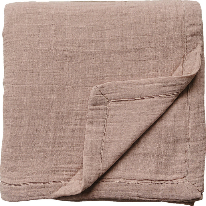 Soft dusty rose muslin quilt by Mebie Baby, a cozy muslin baby blanket perfect for infants.
