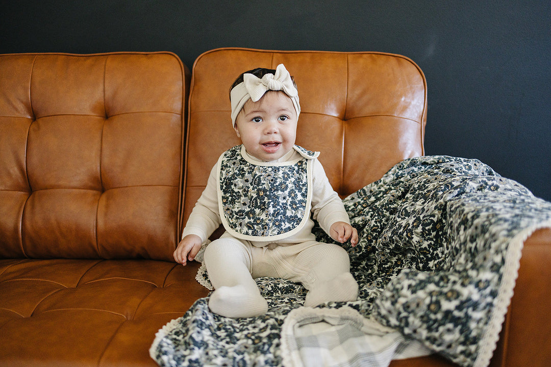 Nursery essential, Mebie BabyÕs Liberty Floral + Coastal Plaid Lace Muslin Quilt works as a soft muslin quilt.