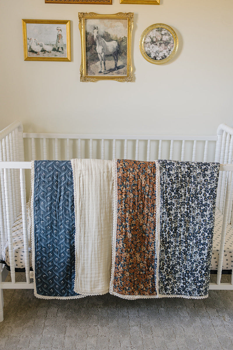 Soft and breathable, the Mebie Baby Venetian Floral + Autumn Bloom Lace Muslin Quilt doubles as a cotton muslin blanket.
