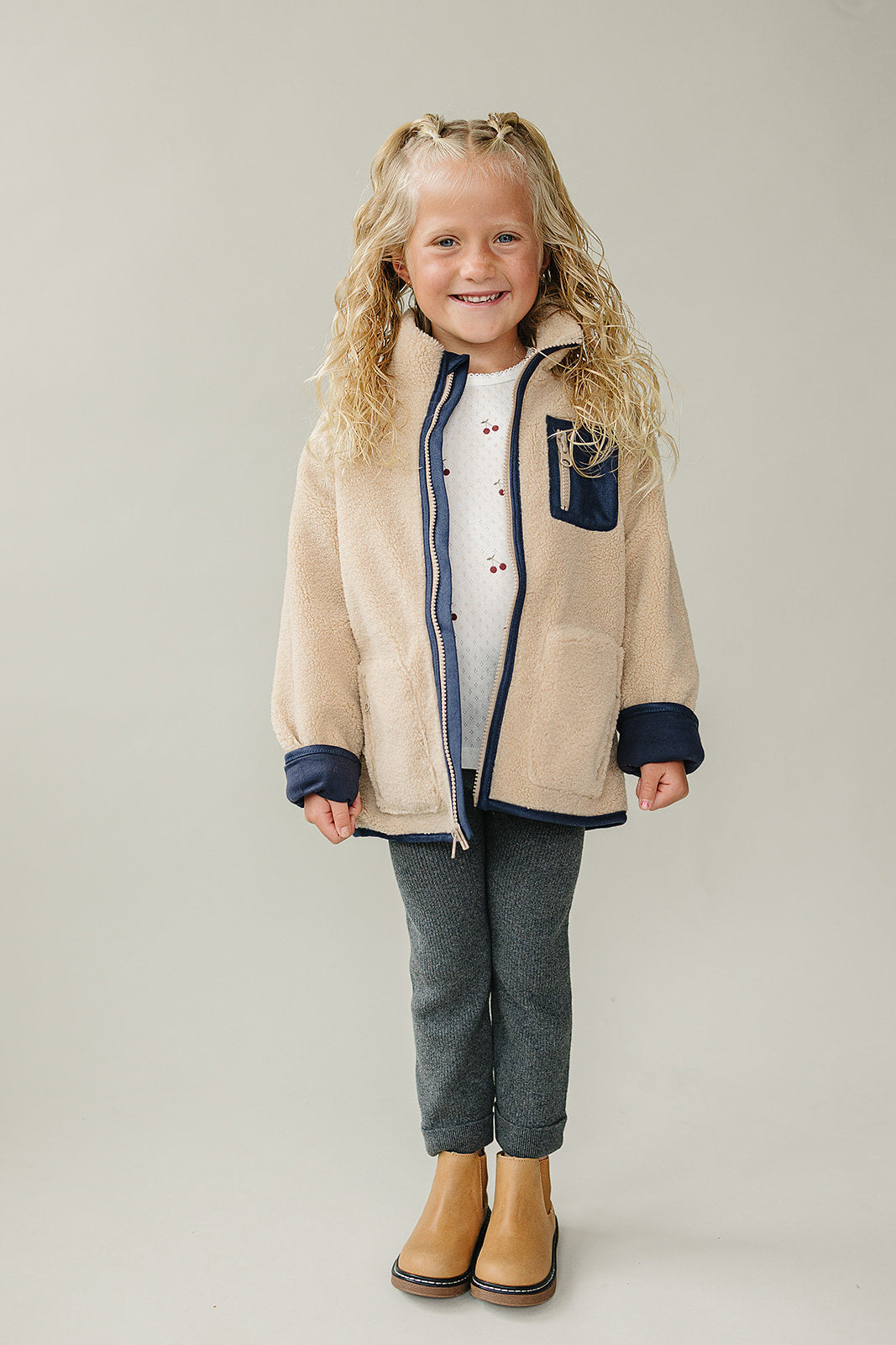 The Mebie Baby Sherpa Zip-Up Jacket offers a cute, versatile layer in organic baby clothes