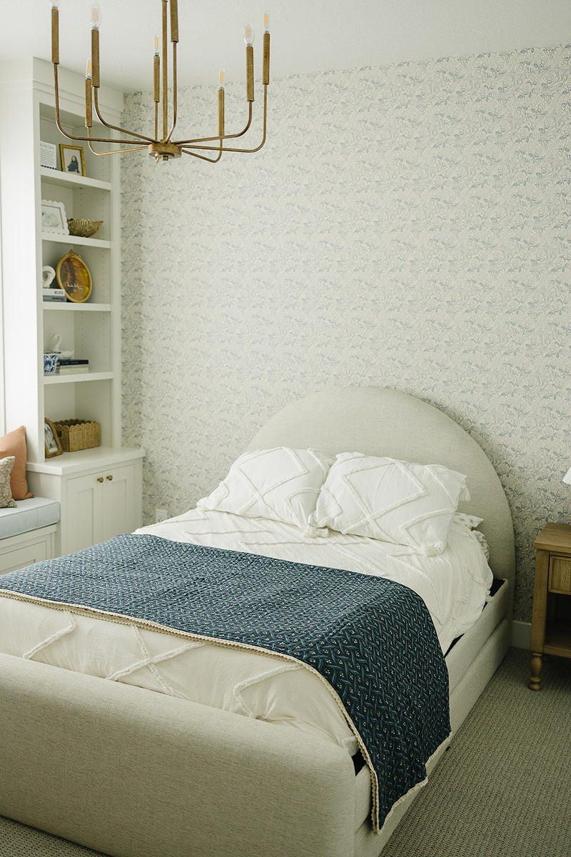 Draped across a nursery chair, this Mebie Baby quilt serves as a delicate muslin throw blanket for infants.