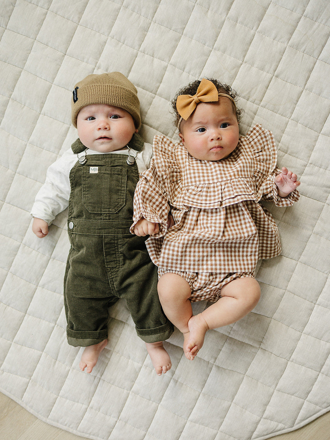 The Mebie Baby Green Corduroy Overalls offer a timeless silhouette, ideal for parents browsing baby clothes online