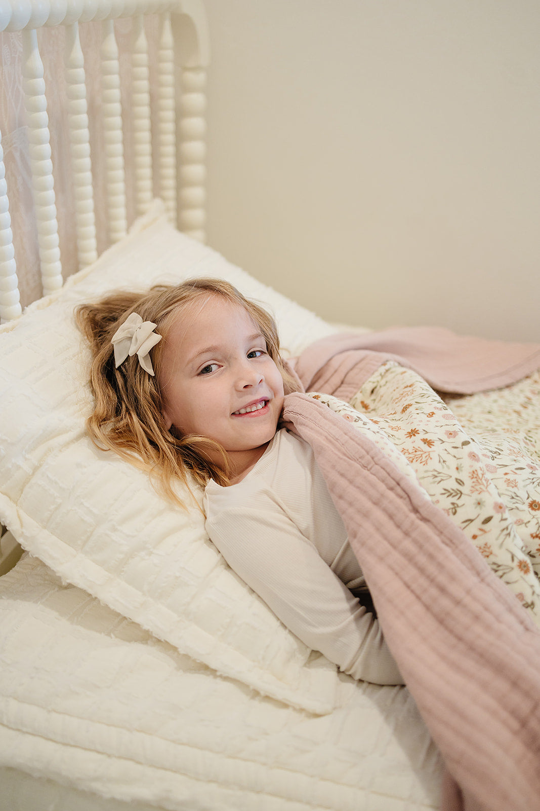 The Mebie Baby Meadow Floral + Dusty Rose Twin Muslin Quilt is soft and versatile, perfect as a muslin blanket.