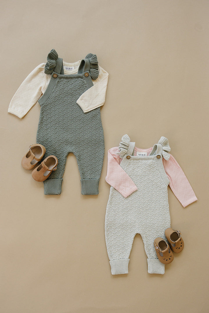 Soft and textured, the Mebie Baby Grey Ruffle Knit Overalls offer a cozy fit for newborn baby clothes collections