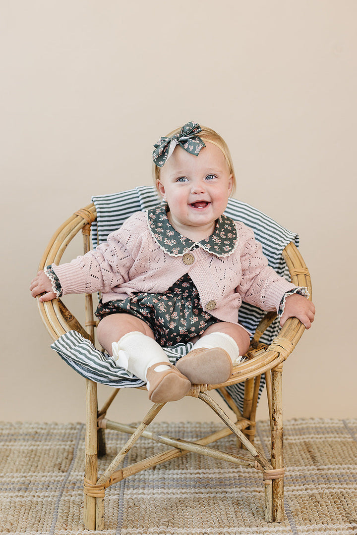 Soft and charming, the Mebie Baby Pink Pointelle Button Down Cardigan is ideal for cute baby clothes collections