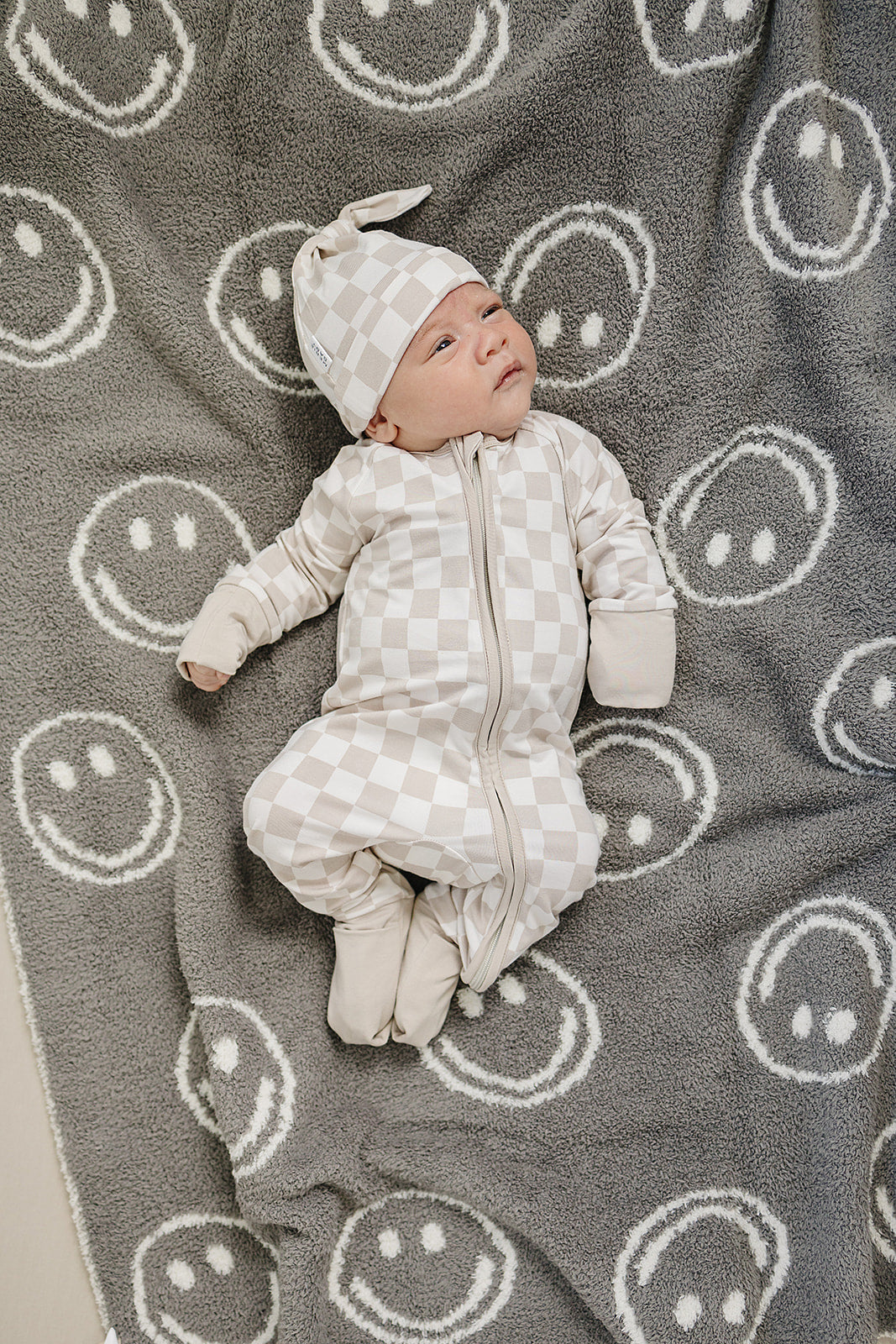 Mebie Baby Taupe Checkered Bamboo Zipper photographed in natural light to show true color
