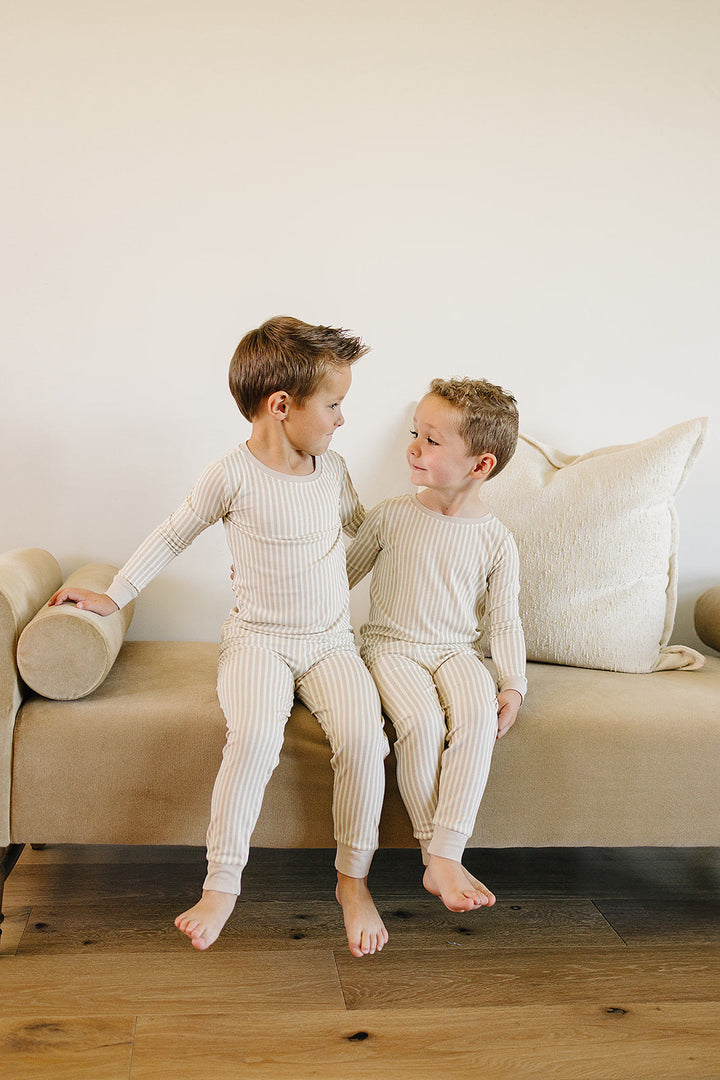 Designed for comfort and style, the Mebie Baby Taupe Stripe Ribbed Bamboo Cozy Set is a top pick in organic baby clothes