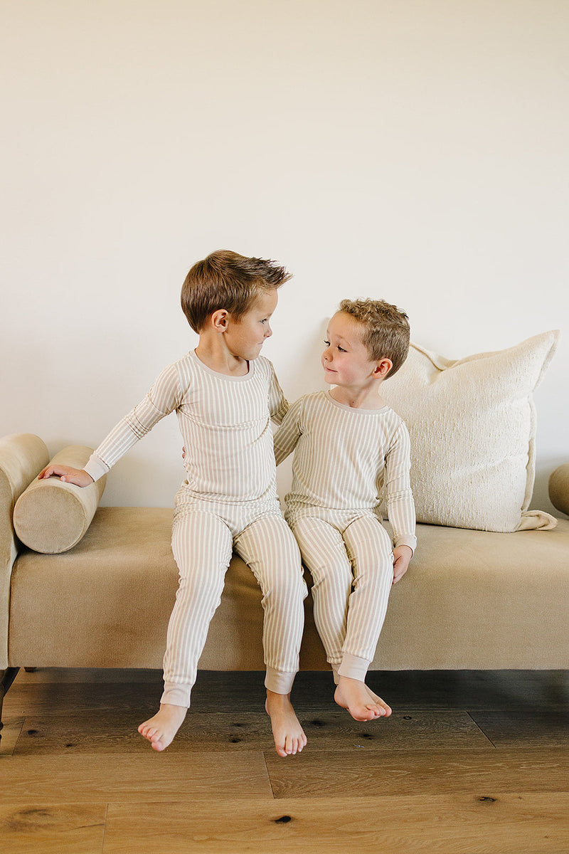 Designed for comfort and style, the Mebie Baby Taupe Stripe Ribbed Bamboo Cozy Set is a top pick in organic baby clothes