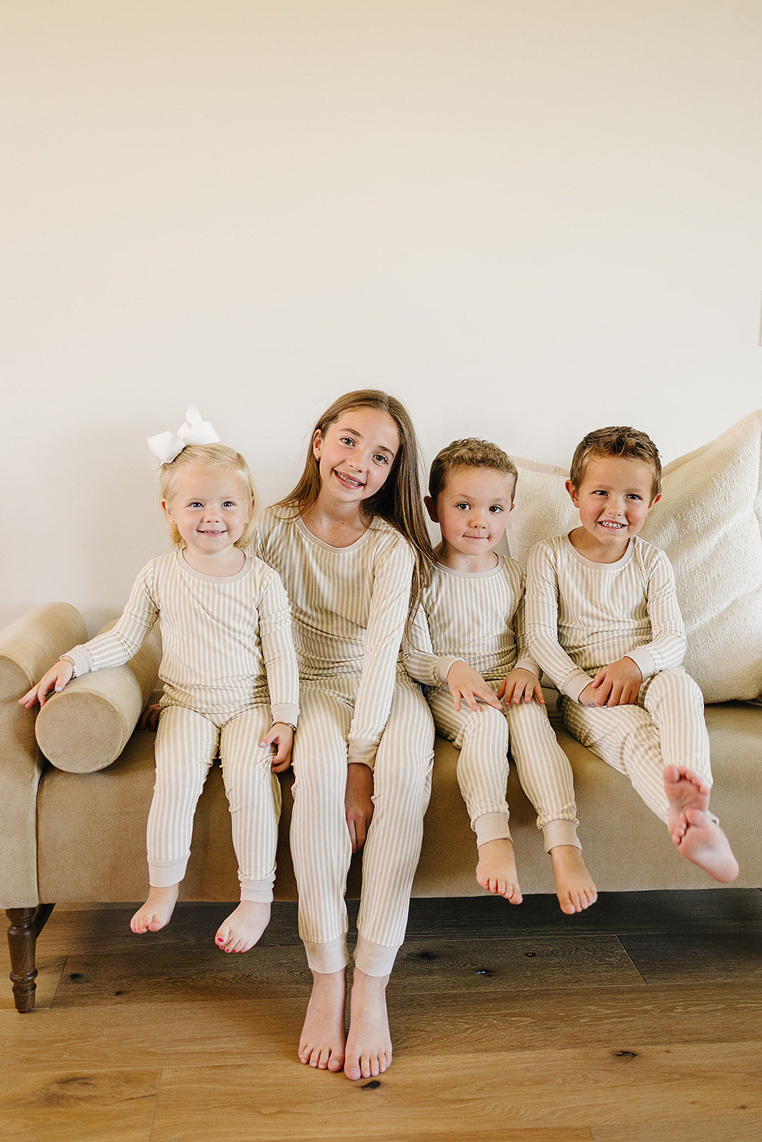 The Mebie Baby Taupe Stripe Ribbed Bamboo Cozy Set offers gentle warmth, a favorite in baby bamboo pajamas