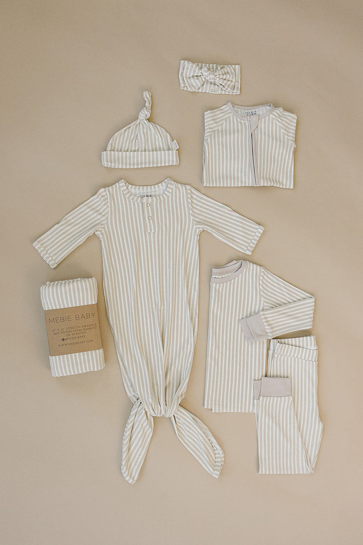 Snuggle your baby in the Mebie Baby Taupe Stripe Ribbed Bamboo Stretch Swaddle, a cozy infant swaddle blanket.