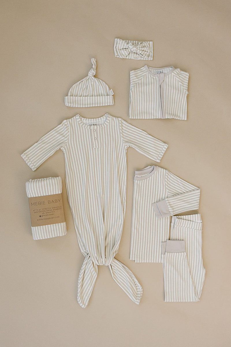 Snuggle your baby in the Mebie Baby Taupe Stripe Ribbed Bamboo Stretch Swaddle, a cozy infant swaddle blanket.