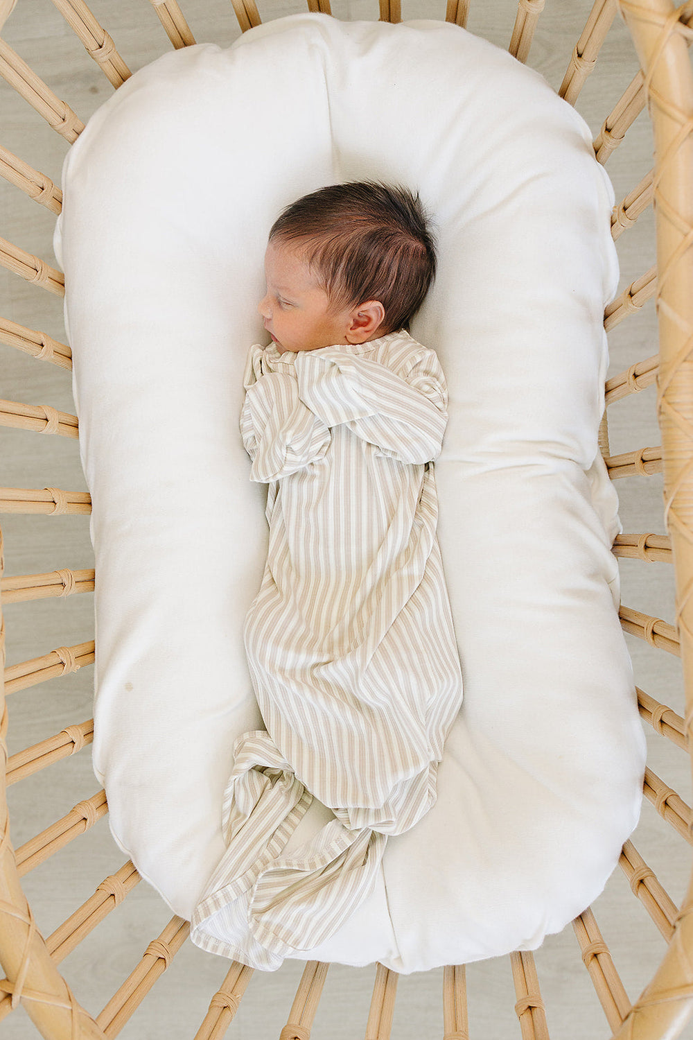 Designed for easy nighttime changes, the Mebie Baby Taupe Stripe Ribbed Bamboo Knot Gown works beautifully as bamboo baby pajamas