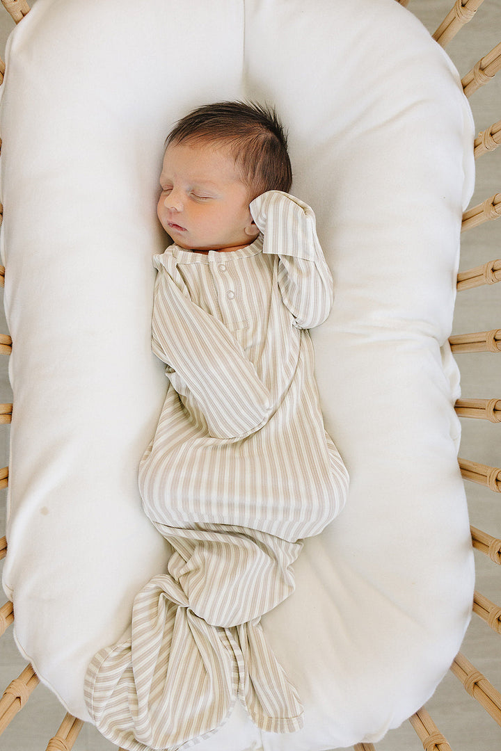 Stretchy and gentle, the Mebie Baby Taupe Stripe Ribbed Bamboo Knot Gown offers comfort similar to baby onesies