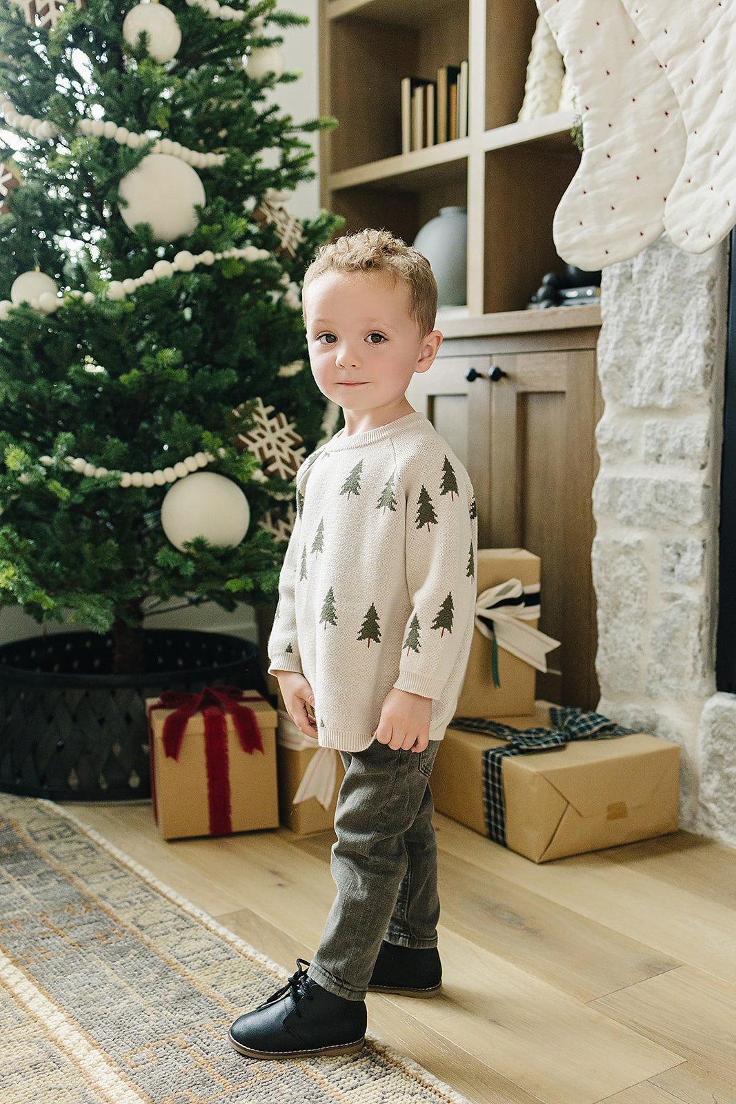 The Mebie Baby Pine Tree Knit Sweater offers warmth and charm, perfect for organic baby clothes collections