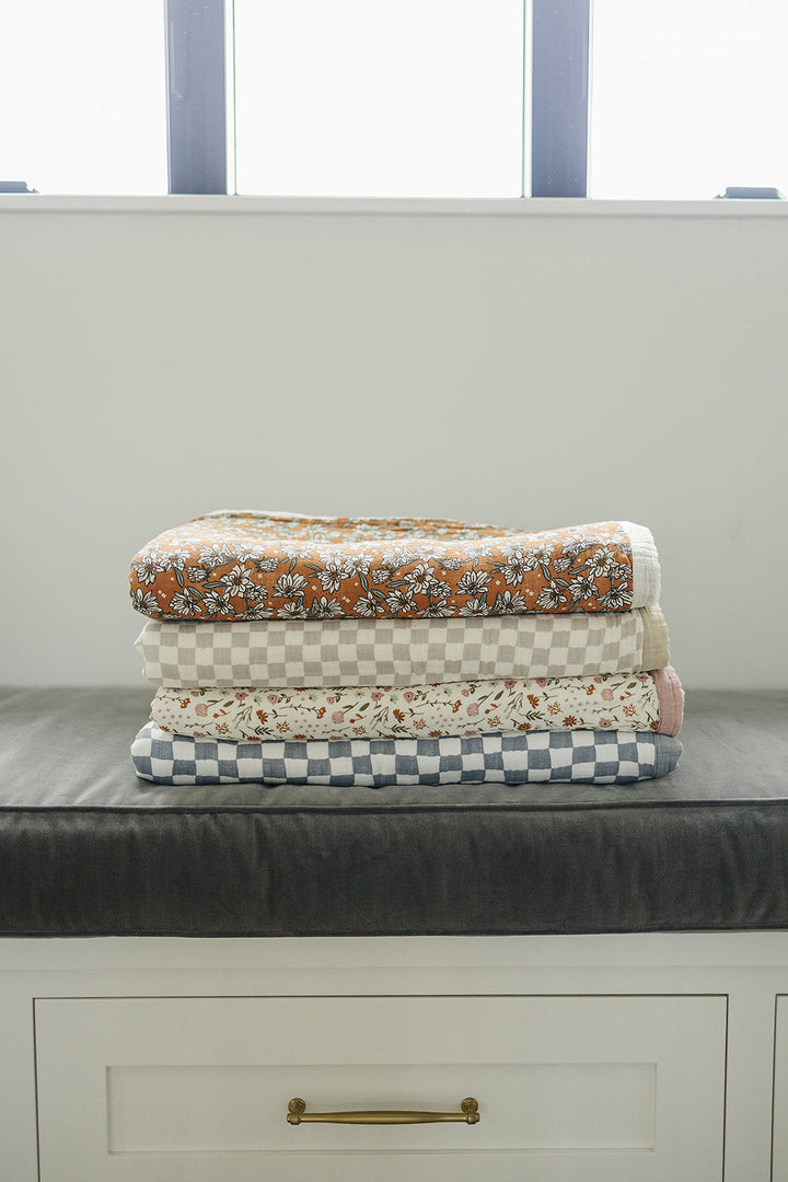 Gentle on sensitive skin, the Mebie Baby Meadow Floral + Dusty Rose Twin Muslin Quilt works as infant muslin blankets.