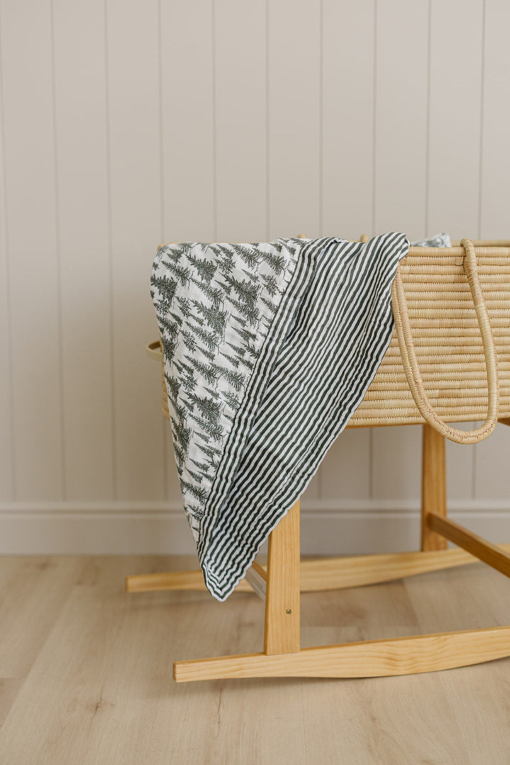 Mebie Baby Forest + Green Stripes Muslin Quilt provides breathable comfort as a gentle muslin.
