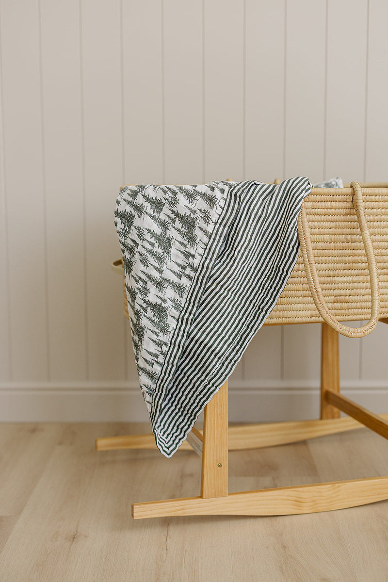 Mebie Baby Forest + Green Stripes Muslin Quilt provides breathable comfort as a gentle muslin.