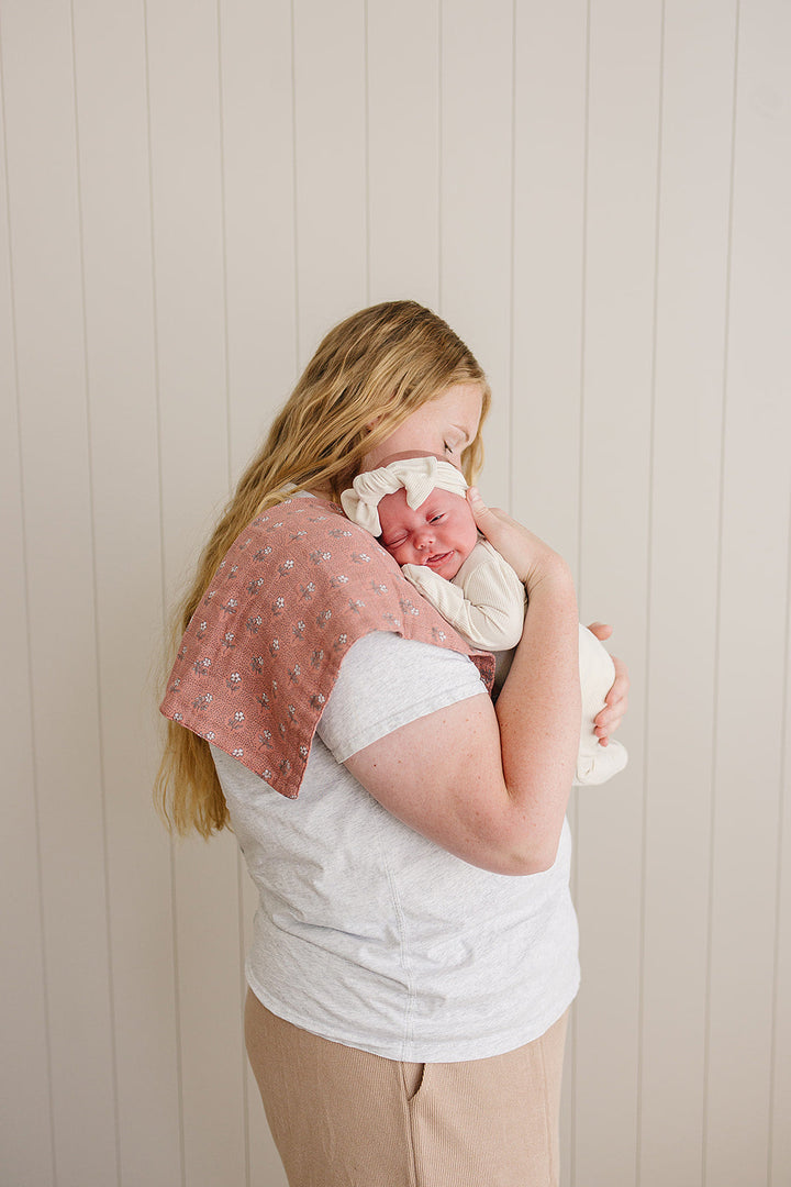 Keep messes at bay with the Vintage Pink Floral Muslin Burp Cloth by Mebie Baby, ideal for muslin burp cloth needs.