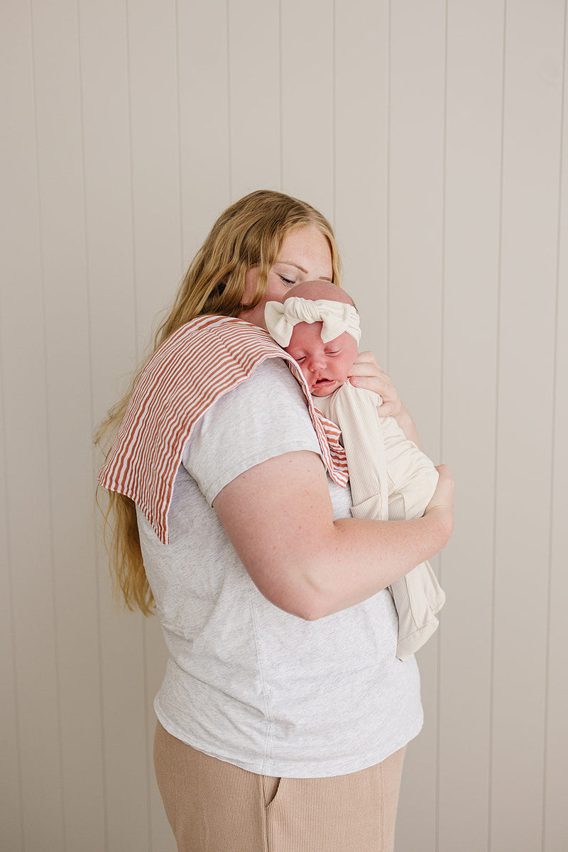 The Pink Stripes Muslin Burp Cloth by Mebie Baby is gentle on baby skin, perfect as baby burp cloths.