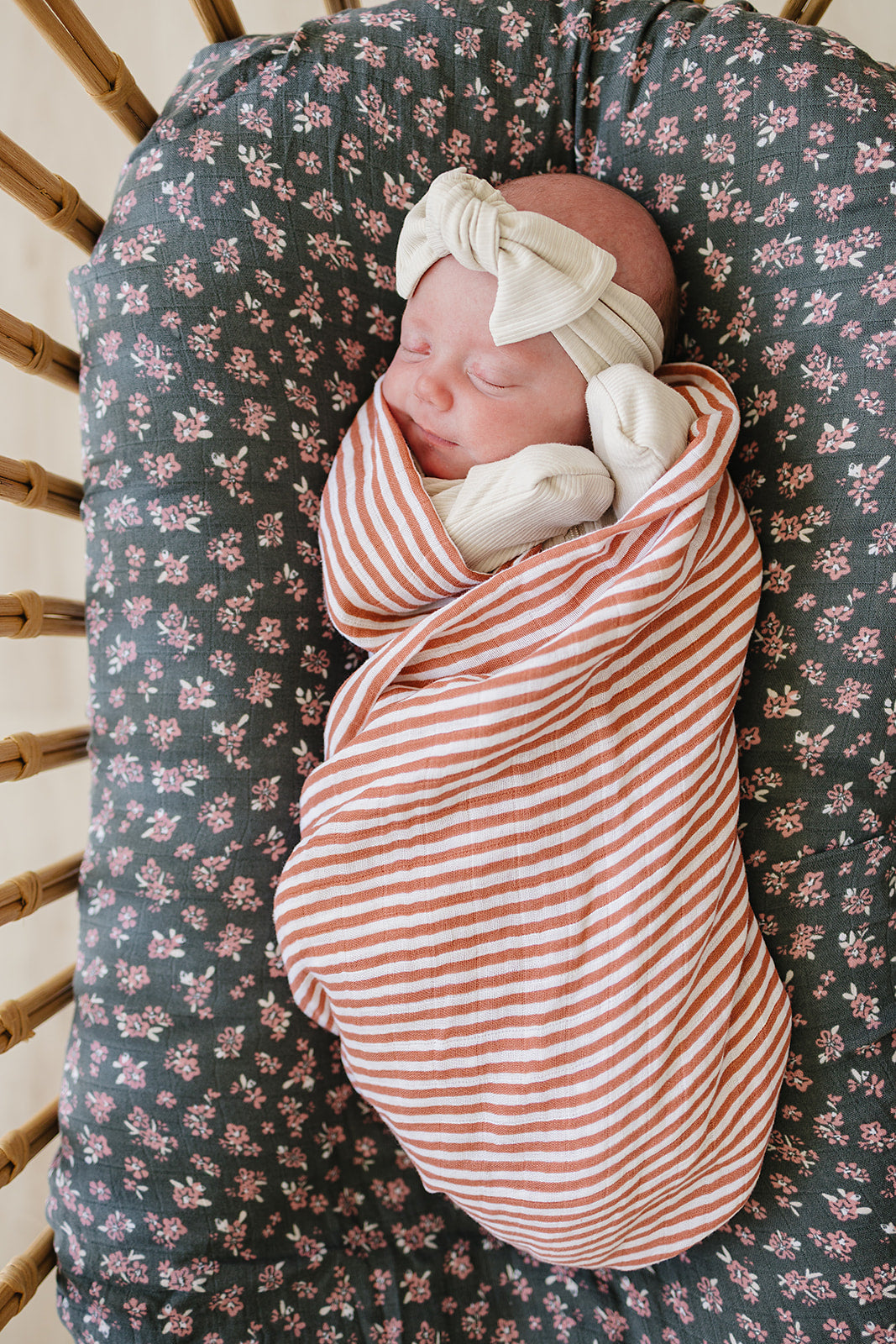 For naps and cuddles, the Mebie Baby Pink Stripes Muslin Swaddle Blanket works as a baby swaddle wrap.
