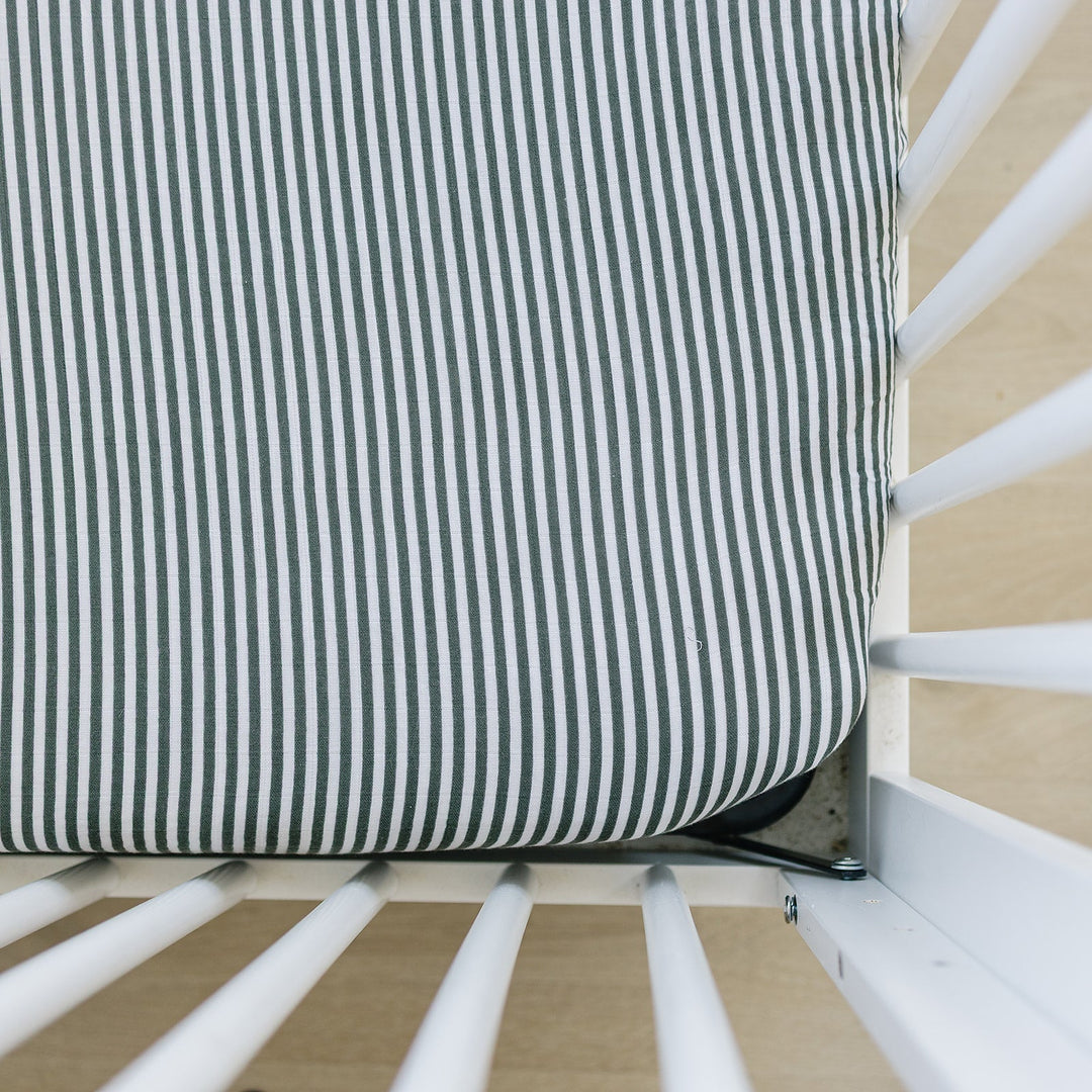 Wrap your babyÕs crib in soft comfort with the Mebie Baby Green Stripes Muslin Crib Sheet, perfect crib sheets.