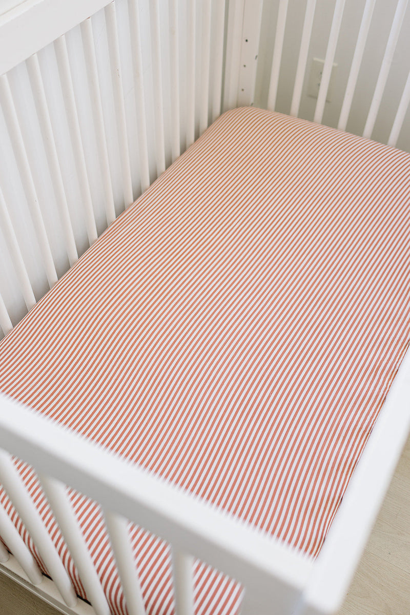 Keep your babyÕs crib comfy with the Mebie Baby Pink Stripes Muslin Crib Sheet, perfect fitted crib sheets.
