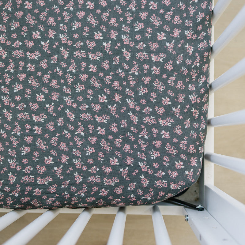 Wrap your babyÕs crib in softness with the Mebie Baby Olive Bloom Muslin Crib Sheet, perfect crib sheets for nurseries.