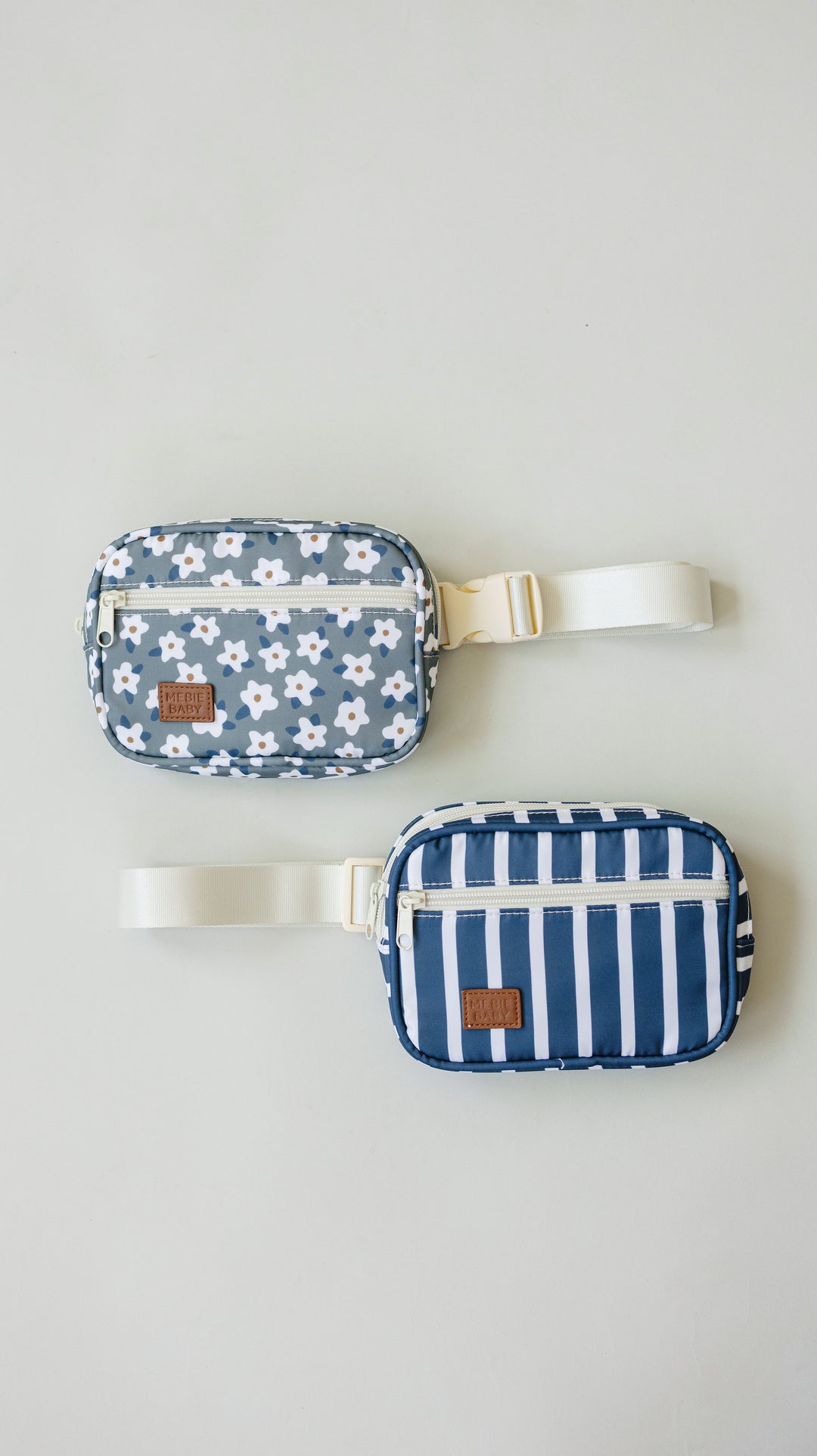 Close-up detail of the Mebie Baby Green Floral Mini Fanny Pack, an easy-wear fanny pack for kids with adjustable strap