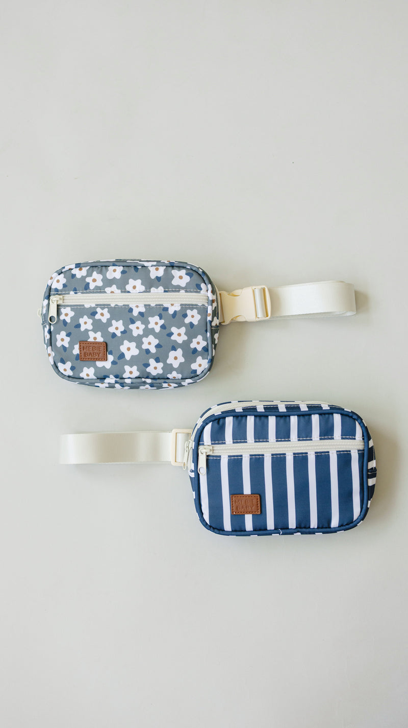 Close-up detail of the Mebie Baby Green Floral Mini Fanny Pack, an easy-wear fanny pack for kids with adjustable strap